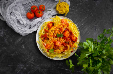 noodles, tomato on concrete backgroundの写真素材