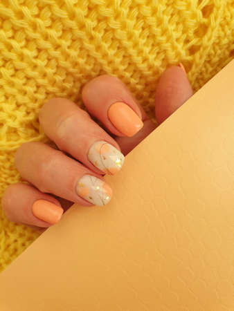 female hand with beautiful manicure cloth modernの写真素材