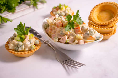 traditional olivier salad in tartletsの写真素材