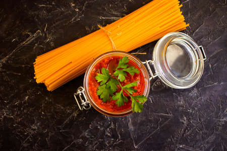 tomato paste, dry pasta on a concrete backgroundの写真素材