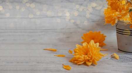 yellow chrysanthemum in a vase on an old backgroundの写真素材