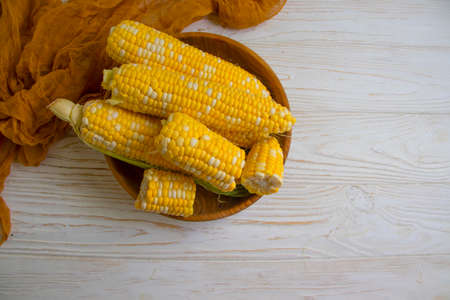 raw corn on wooden backgroundの写真素材