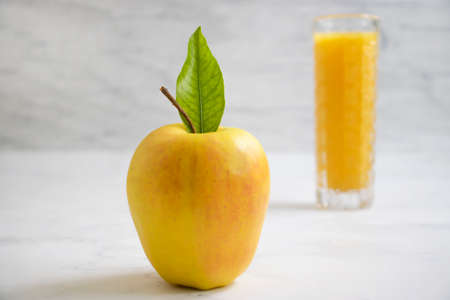 apple, fresh juice on wooden background