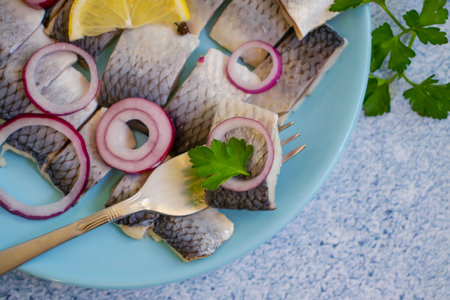 delicious herring, blue onion parsley portion appetizerの写真素材