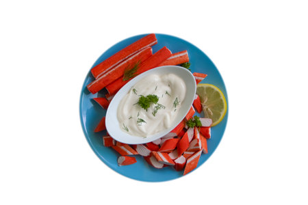 plate of crab sticks, sauce isolated on white backgroundの写真素材