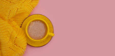 coffee cup yellow sweaterの写真素材