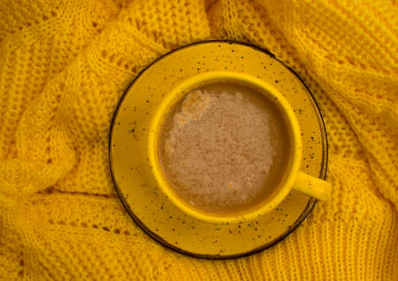 coffee cup yellow sweaterの写真素材