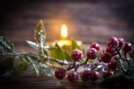 festive christmas background, candle, christmas tree branchの写真素材