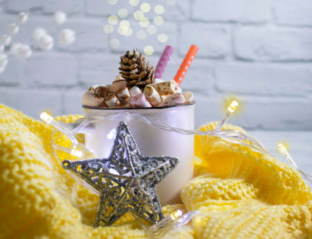 cup with marshmallows, garland festive backgroundの写真素材