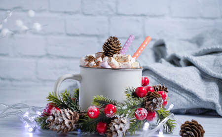 cup with marshmallows, garland festive backgroundの写真素材