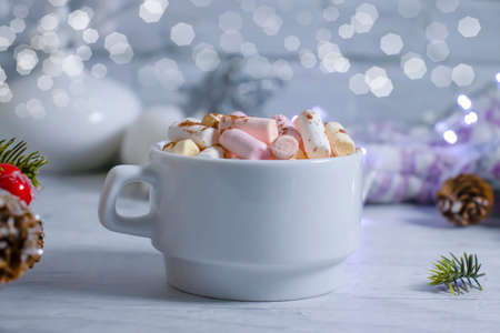 cup with marshmallows, garland festive backgroundの写真素材