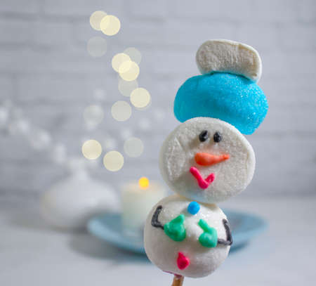 fanny marshmallows in a plate christmas backgroundの写真素材