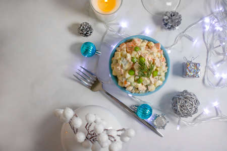 olivier salad in a plate christmas backgroundの写真素材