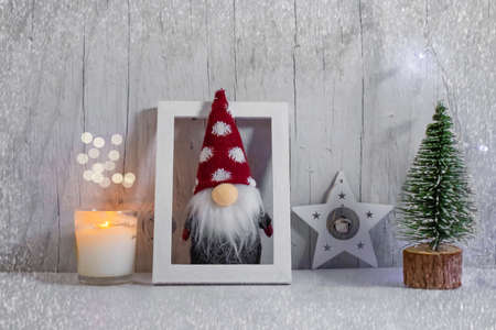decorative christmas tree, gnome on wooden backgroundの写真素材