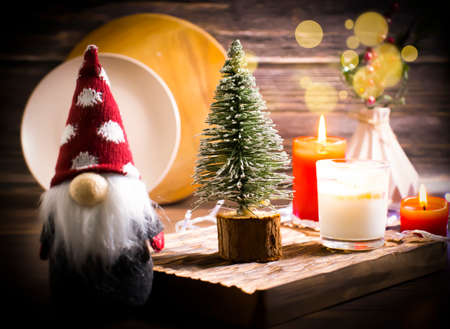 decorative christmas tree, gnome on wooden backgroundの写真素材