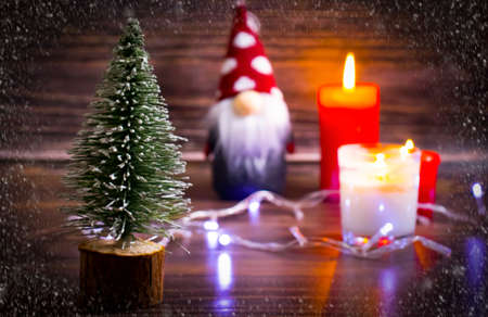 decorative christmas tree, gnome on wooden backgroundの写真素材