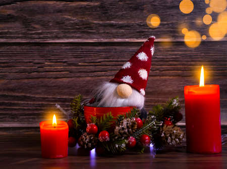 decorative christmas tree, gnome on wooden backgroundの写真素材