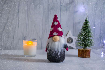 decorative christmas tree, gnome on wooden backgroundの写真素材