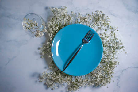 plate of gypsophila flower on concrete backgroundの写真素材