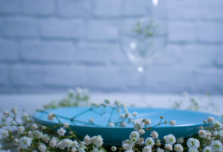 plate of gypsophila flower on concrete backgroundの写真素材