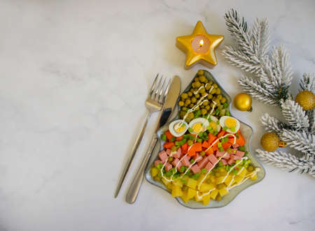 Olivier salad in a plate festive backgroundの写真素材