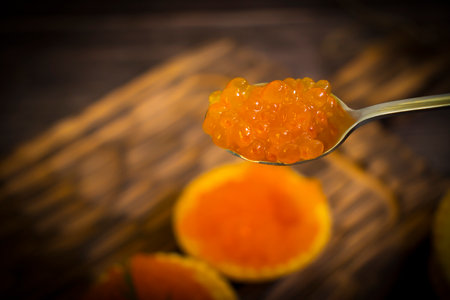 red caviar in a tartlet on a wooden backgroundの写真素材