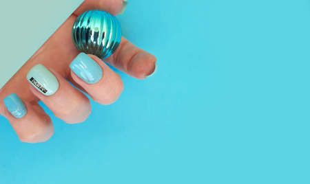 female hand beautiful blue manicure