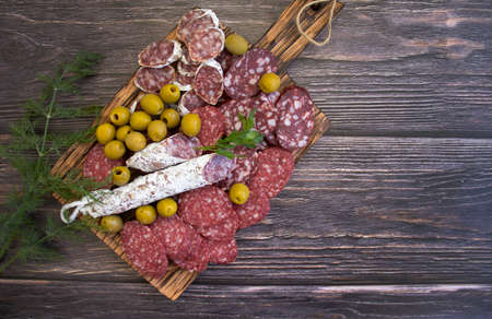 delicious sausage, olives, dill background assortment menu