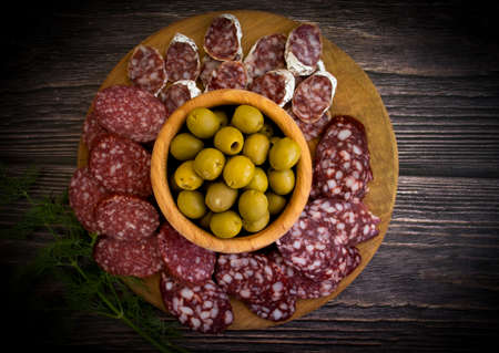 delicious sausage, olives, dill background assortment menuの写真素材