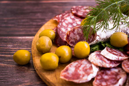delicious sausage, olives, dill background assortment menuの写真素材