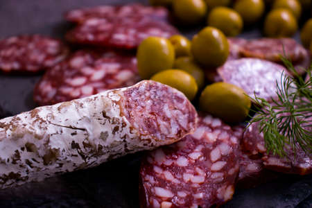 delicious sausage, olives, dill background assortment menuの写真素材