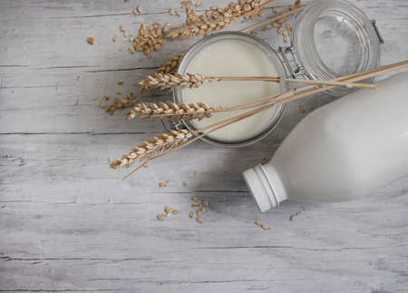 oat milk on wooden backgroundの写真素材