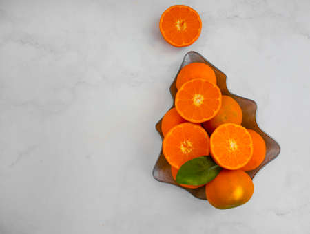 fresh tangerines in a plate backgroundの写真素材