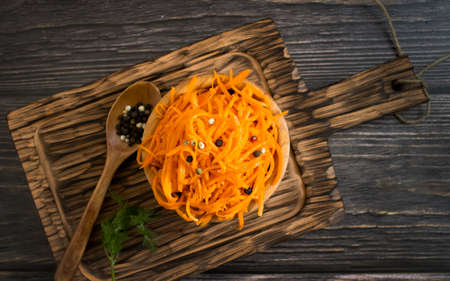 korean carrots on wooden backgroundの写真素材