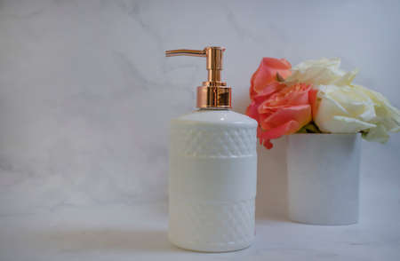 liquid soap rose flower on marble backgroundの写真素材