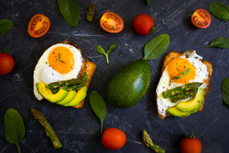 sandwich with egg, avocado, asparagus on old backgroundの写真素材