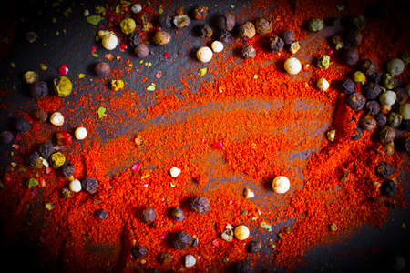 spices turmeric, pepper in on a dark background