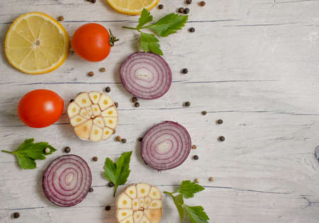 onion, spices, garlic on the old background