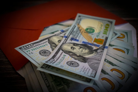 american dollars in an envelope on a wooden backgroundの写真素材