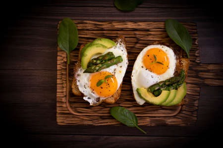 fried egg sandwich, asparagus, avocadoの写真素材