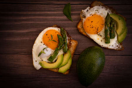fried egg sandwich, asparagus, avocadoの写真素材