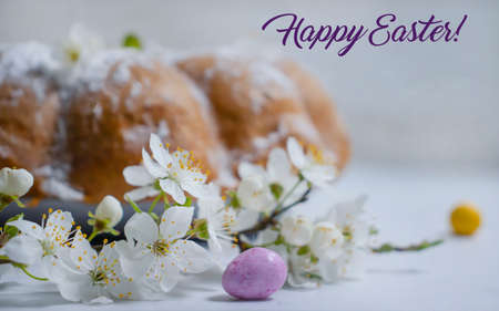 Easter cake, cherry blossoms on a light background