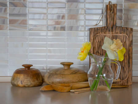 Wooden utensils, narcissus flower kitchen backgroundの写真素材