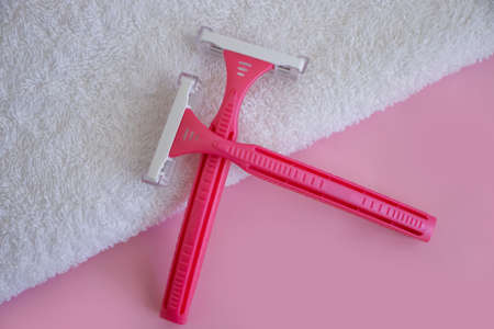 pink razor towel on colored backgroundの写真素材