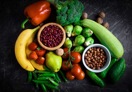 Different vegetables and fruits on an old backgroundの写真素材