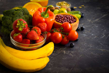 Different vegetables and fruits on an old backgroundの写真素材