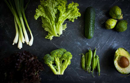 Green vegetables on old background