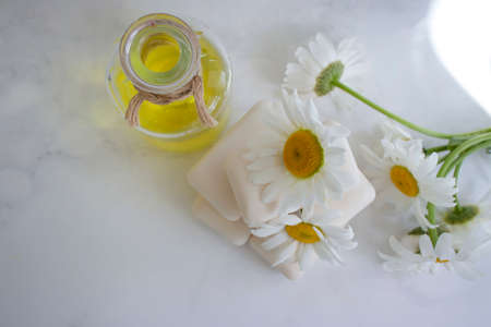 natural soap, chamomile flower on a light backgroundの写真素材