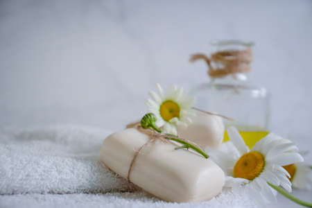 natural soap, chamomile flower on a light backgroundの写真素材