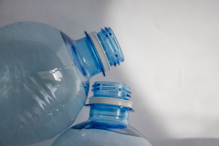 Empty plastic bottle blue background